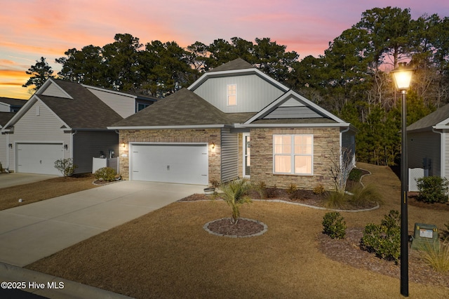 craftsman-style home with a lawn and a garage