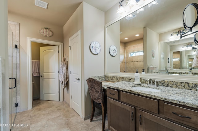 bathroom with vanity and walk in shower