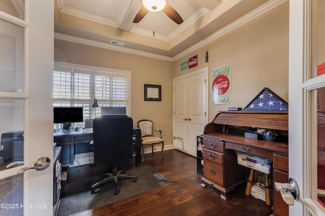 home office featuring dark hardwood / wood-style flooring, ornamental molding, and ceiling fan