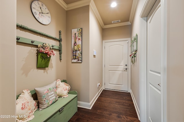 doorway featuring crown molding and dark wood-type flooring