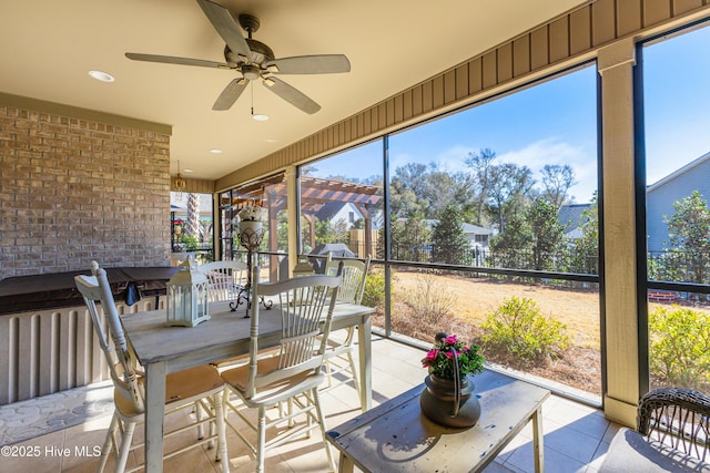 sunroom / solarium with ceiling fan