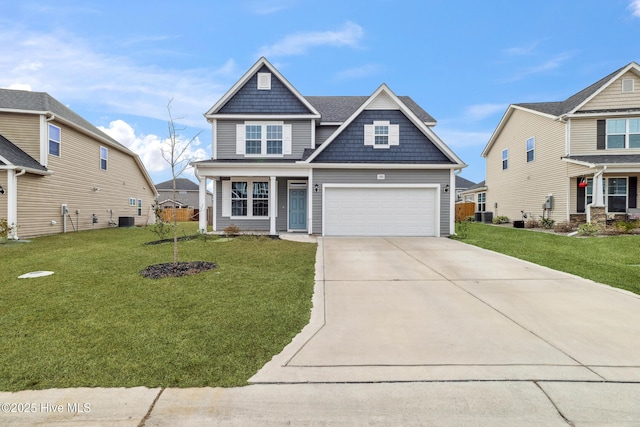 view of front facade featuring a garage, cooling unit, and a front lawn