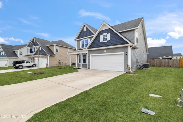 view of front of house featuring a garage, cooling unit, and a front lawn