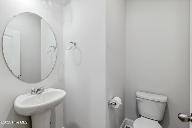 bathroom featuring toilet and sink