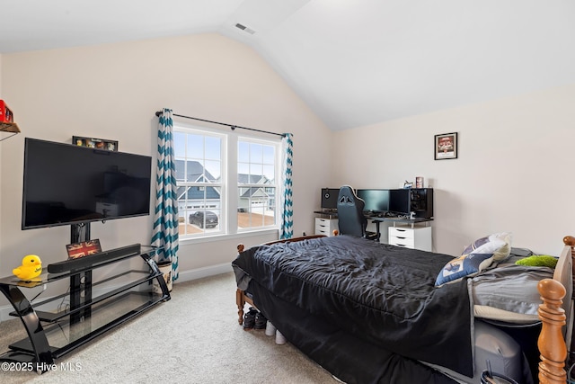 carpeted bedroom featuring vaulted ceiling