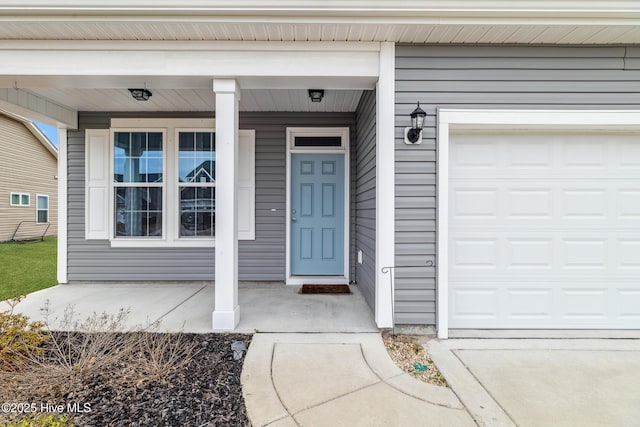 property entrance with a garage