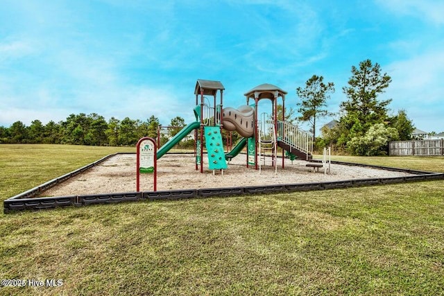 view of jungle gym featuring a lawn