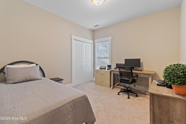 carpeted bedroom featuring a closet