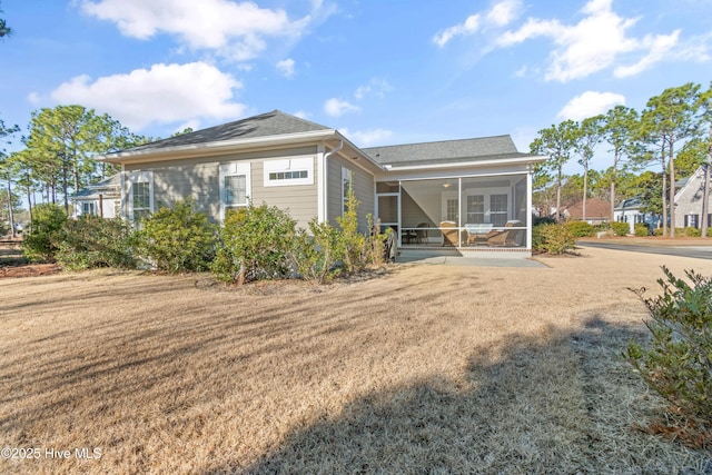 back of property featuring a sunroom