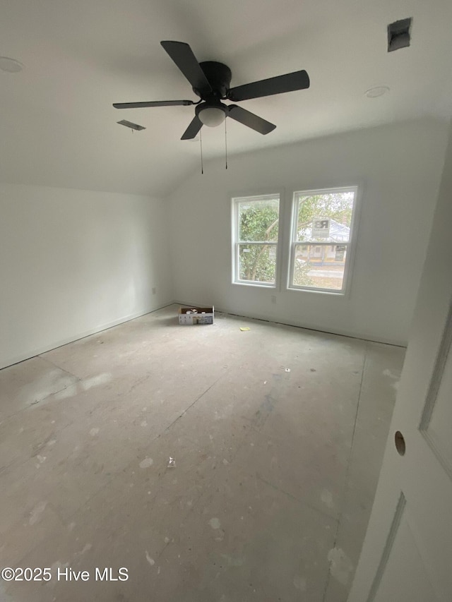 spare room with ceiling fan and lofted ceiling