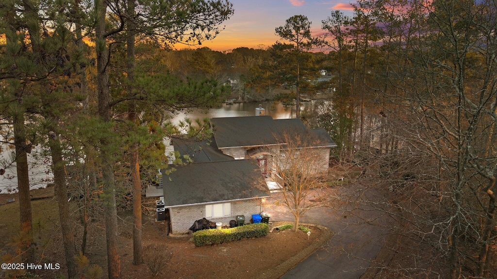 aerial view at dusk with a water view