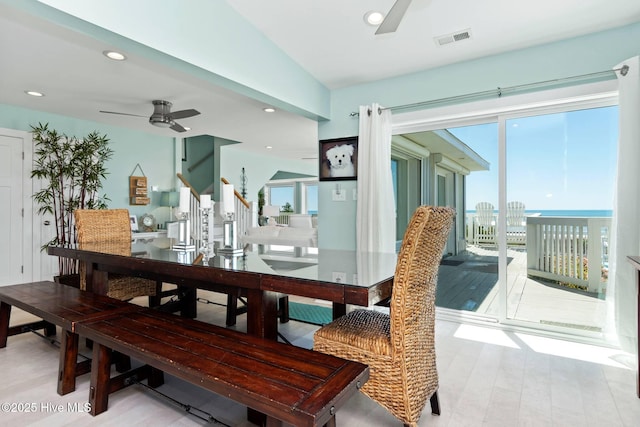 dining area with plenty of natural light, ceiling fan, light hardwood / wood-style flooring, and vaulted ceiling