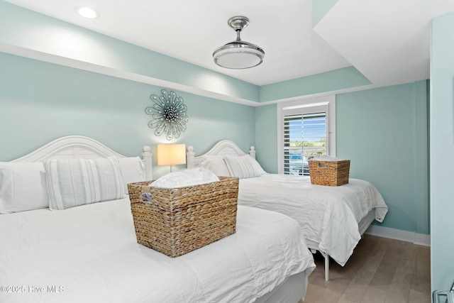 bedroom with hardwood / wood-style floors