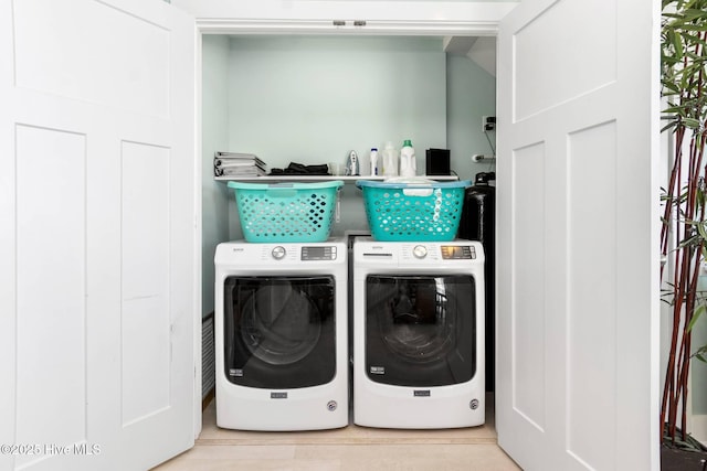 laundry room featuring independent washer and dryer