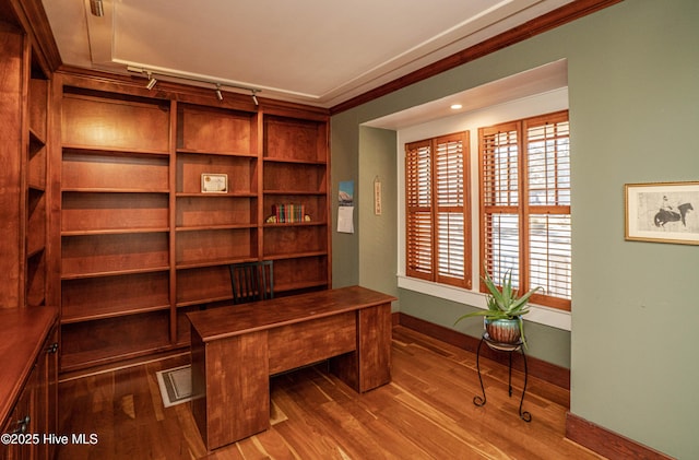 office featuring wood-type flooring and crown molding