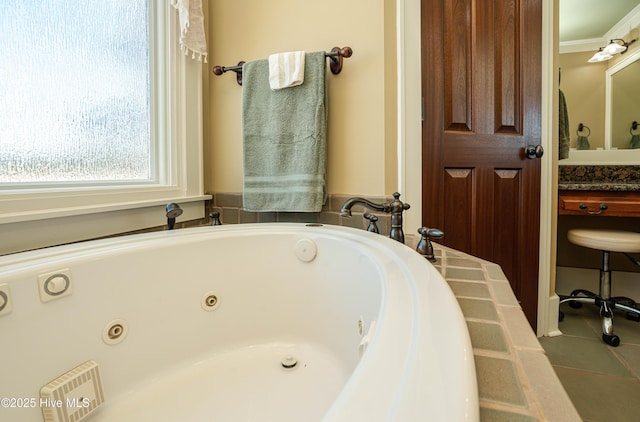 bathroom with tile patterned floors, ornamental molding, and a tub to relax in