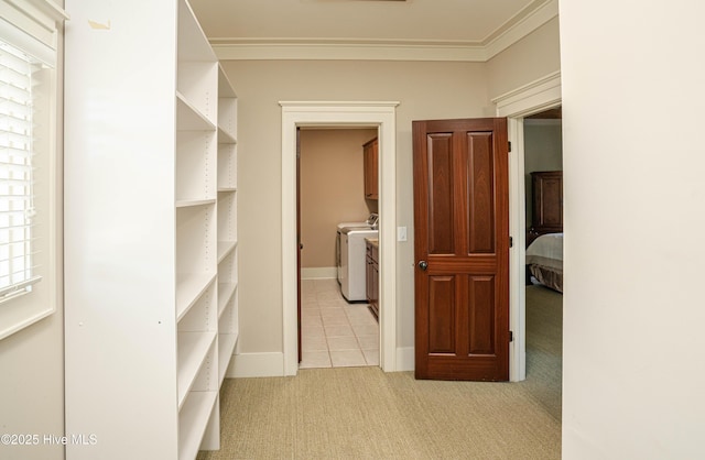 interior space featuring light carpet and separate washer and dryer