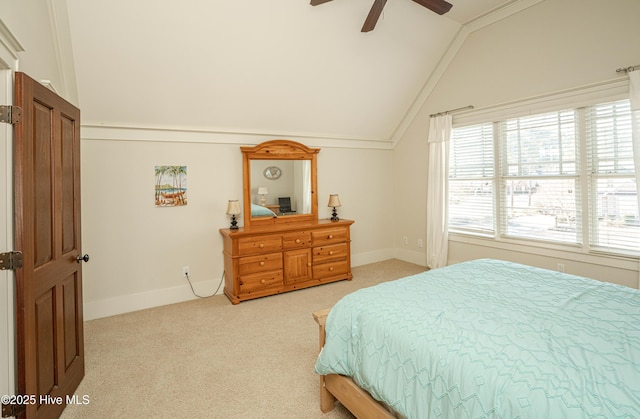 bedroom with ceiling fan, light carpet, and lofted ceiling