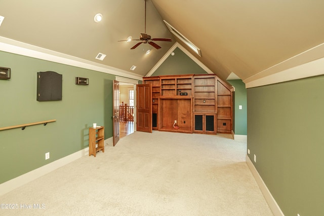 unfurnished living room featuring ceiling fan, light carpet, and lofted ceiling