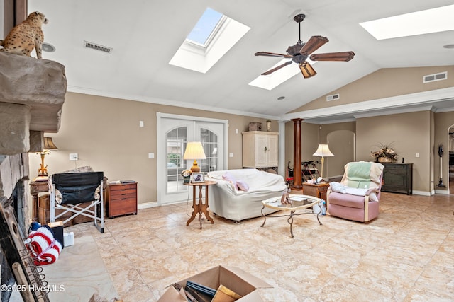 living room with ceiling fan, lofted ceiling, ornamental molding, and french doors