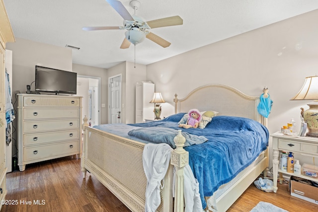 bedroom featuring ceiling fan and hardwood / wood-style floors