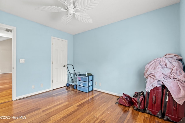 miscellaneous room with ceiling fan and wood-type flooring