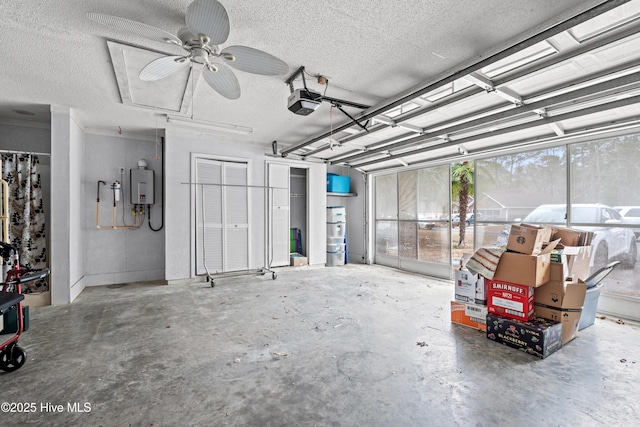 garage with ceiling fan, water heater, and a garage door opener