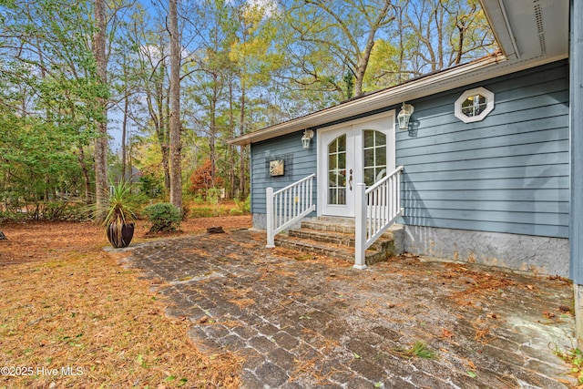 entrance to property featuring french doors