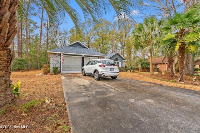 exterior space featuring a garage and an outdoor structure