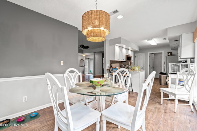 dining space featuring ceiling fan