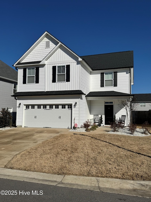 front facade featuring a garage and a porch