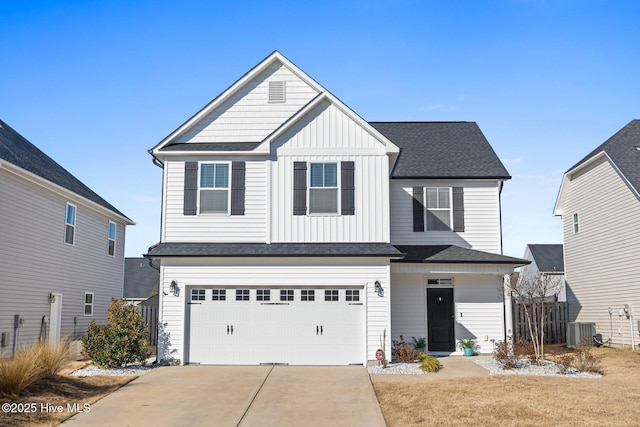 view of front of house featuring central AC and a garage