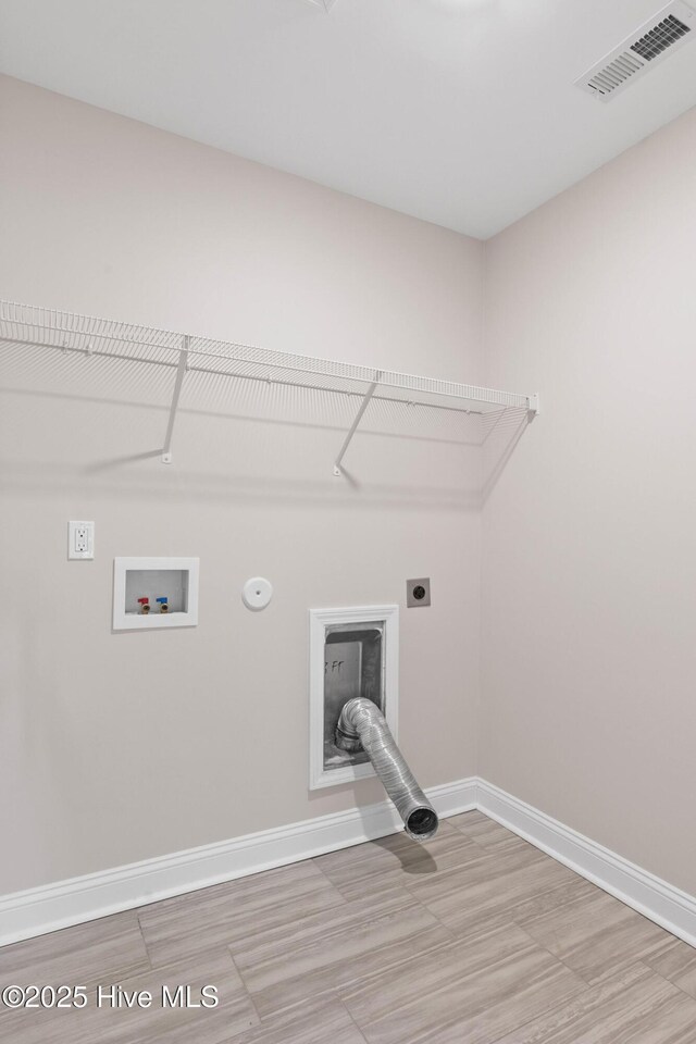 washroom featuring hookup for a washing machine, gas dryer hookup, and hookup for an electric dryer