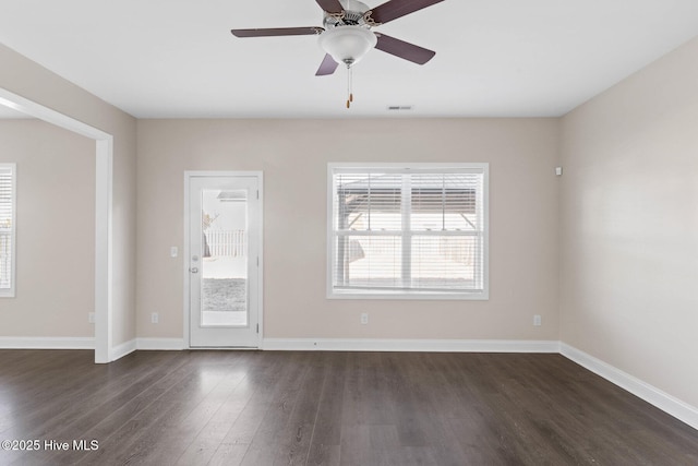 unfurnished room featuring ceiling fan and dark hardwood / wood-style floors