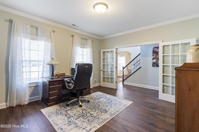 home office featuring dark wood-type flooring, a wealth of natural light, and french doors