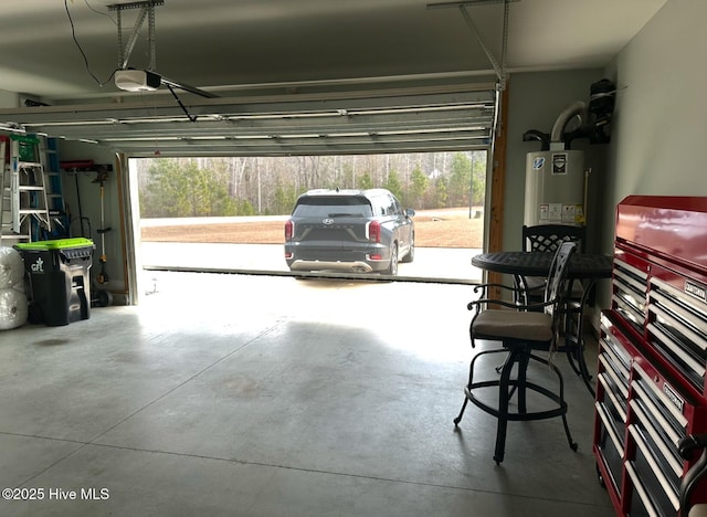 garage featuring a garage door opener and water heater