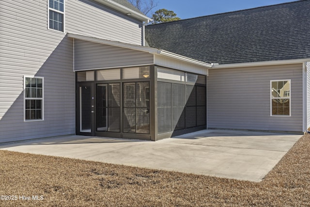 view of exterior entry featuring a patio