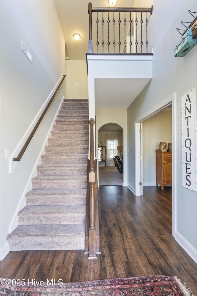 stairway featuring hardwood / wood-style flooring