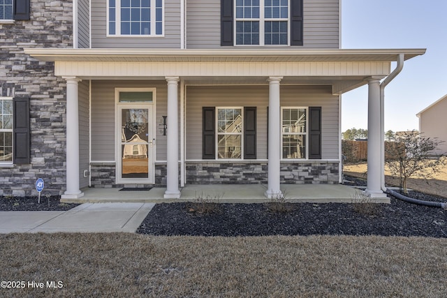 entrance to property featuring a porch