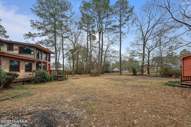 view of yard with a wooden deck