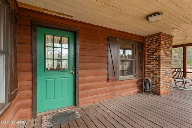 doorway to property featuring covered porch