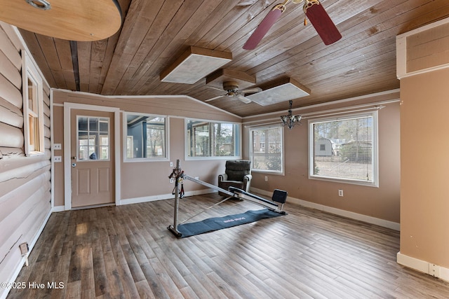 exercise area featuring a ceiling fan, wood finished floors, wood ceiling, baseboards, and lofted ceiling