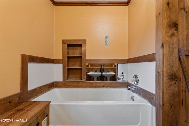 full bathroom with a bath and a sink