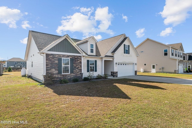 view of front of property with a garage and a front lawn