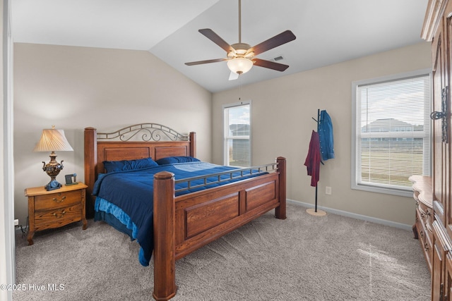 bedroom featuring ceiling fan, light carpet, and vaulted ceiling