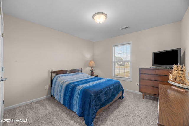 bedroom with light carpet