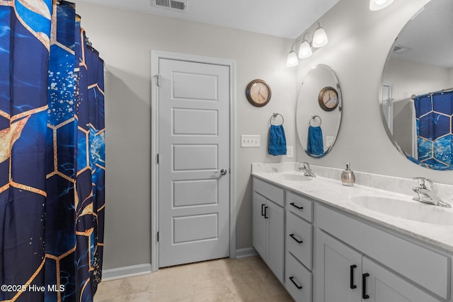 bathroom with vanity, a shower with shower curtain, and tile patterned flooring