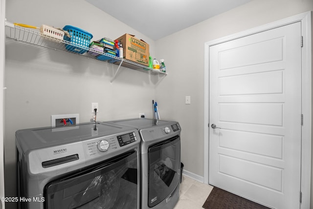 laundry room featuring washer and clothes dryer