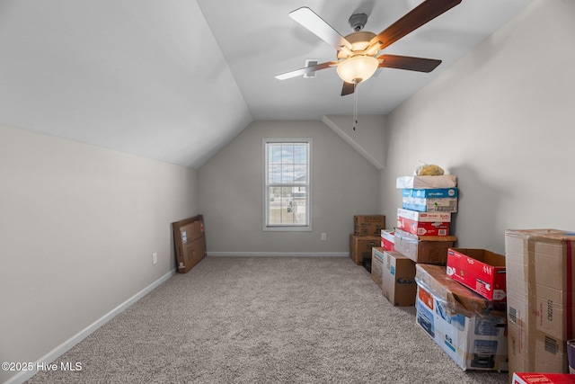 additional living space with ceiling fan, carpet, and lofted ceiling