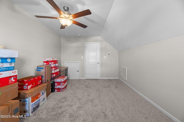 additional living space with vaulted ceiling, ceiling fan, and carpet